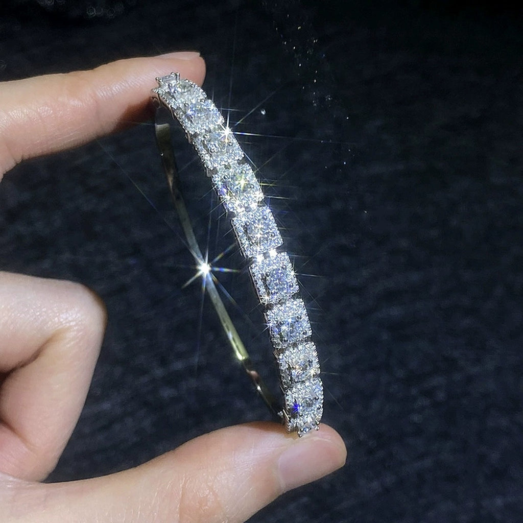 Three-Row Moissanite Bangle Bracelet hand-held close-up showing stone detail, width, and bracelet finish