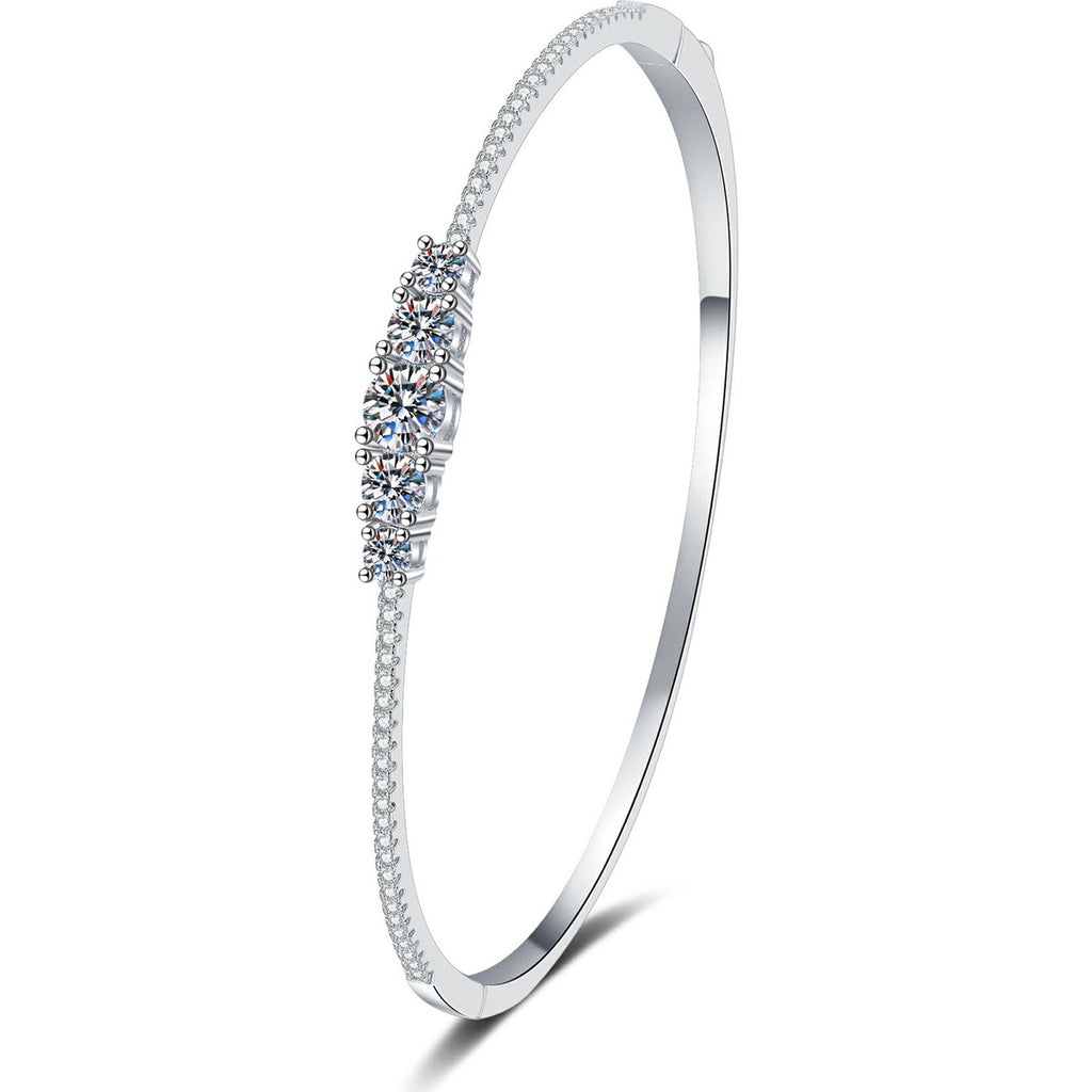 Graduated Moissanite Bangle Bracelet with CZ white background product photo showing bracelet silhouette and moissanite setting