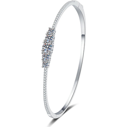 Graduated Moissanite Bangle Bracelet with CZ white background product photo showing bracelet silhouette and moissanite setting