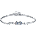 Round Moissanite Adjustable Bangle Bracelet with CZ white background product photo showing bracelet silhouette and moissanite setting