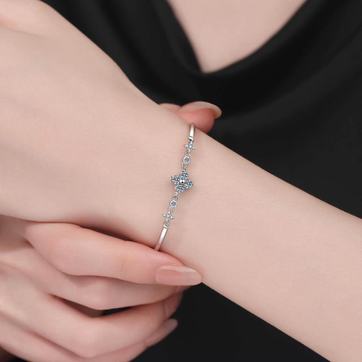 Floral Moissanite Adjustable Bangle Bracelet with CZ worn on wrist model view showing bracelet scale and fit