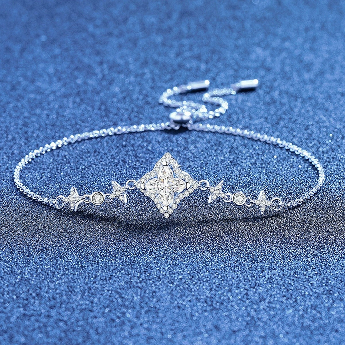 Star Cut Moissanite Adjustable Bracelet with CZ styled on blue display background showing moissanite sparkle and chain detail