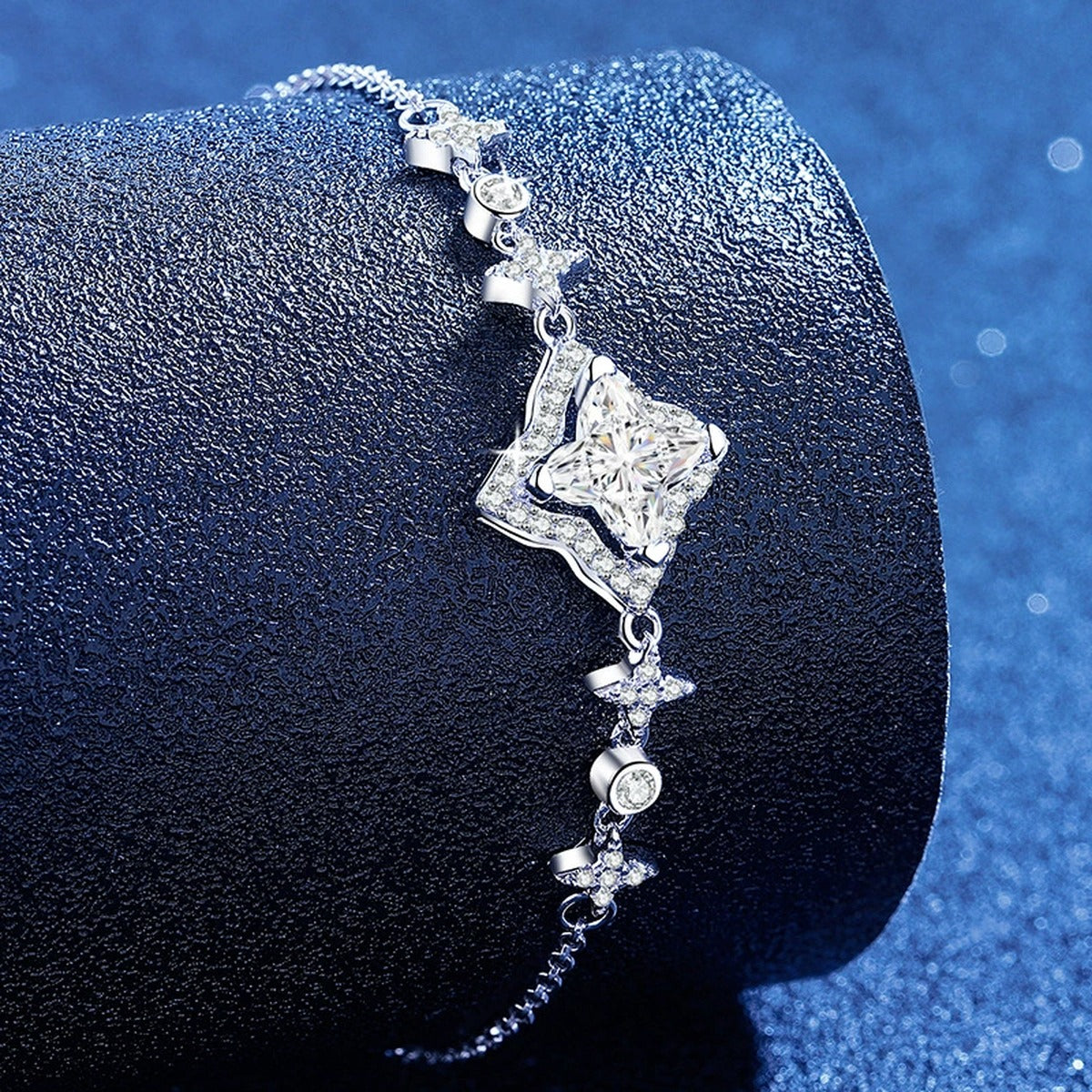 Star Cut Moissanite Adjustable Bracelet with CZ styled on blue display background showing moissanite sparkle and chain detail