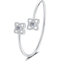 Two-Stone Moissanite Adjustable Bangle Bracelet with CZ white background product photo showing bracelet silhouette and moissanite setting