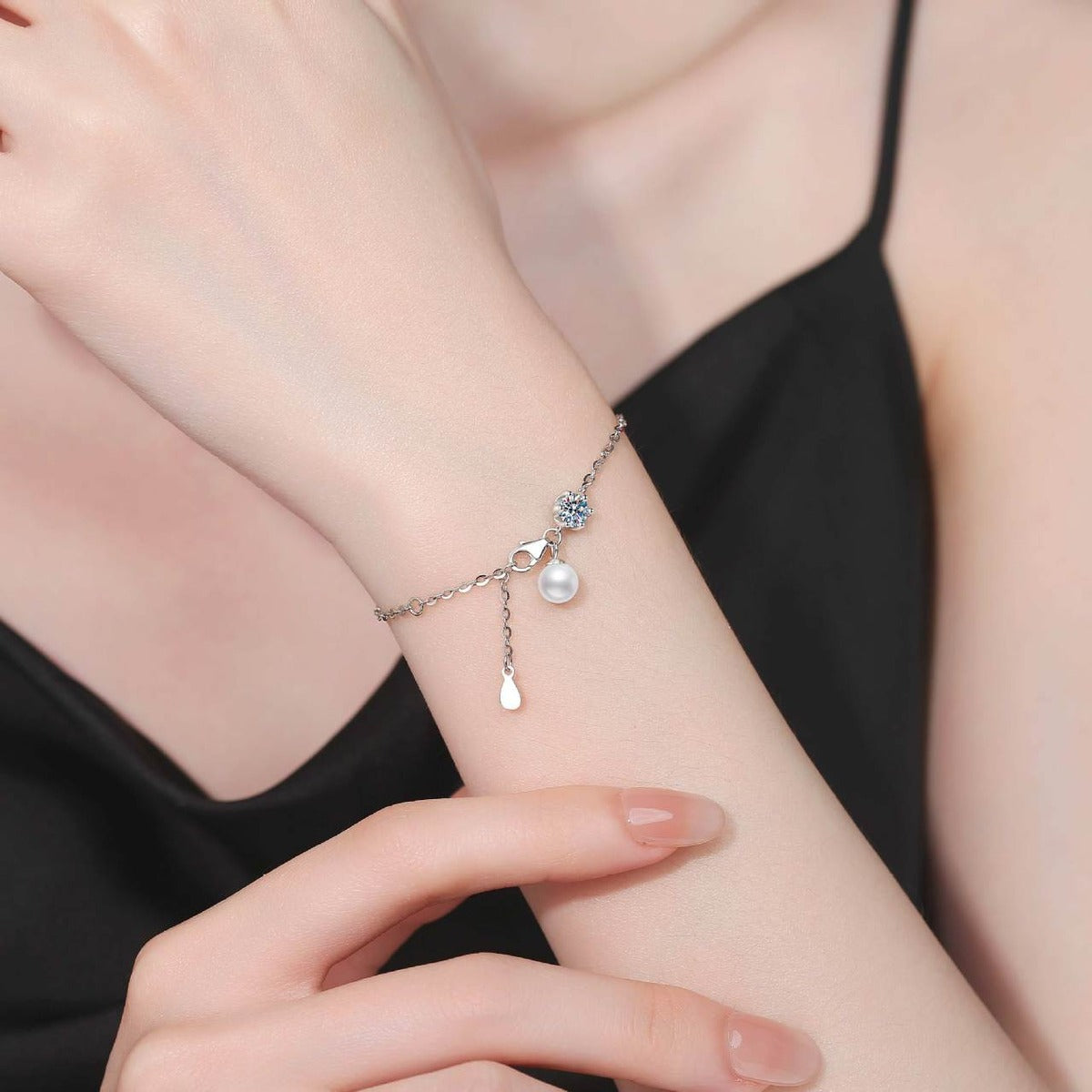 Pearl and Moissanite Chain Bracelet worn on wrist model view showing bracelet scale and fit