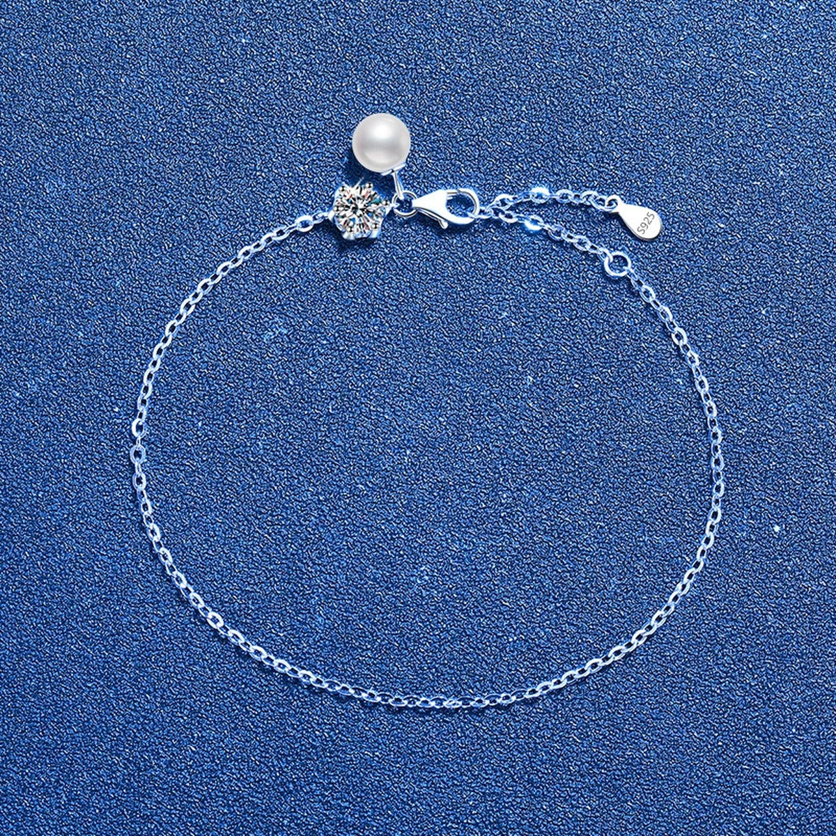 Pearl and Moissanite Chain Bracelet styled on blue display background showing moissanite sparkle and chain detail