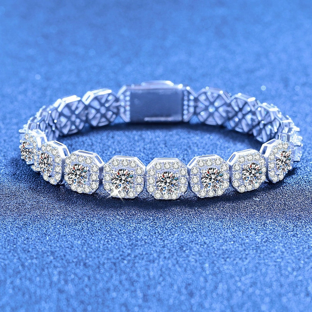 Wide Moissanite Tennis Bracelet with CZ styled on blue display background showing moissanite sparkle and chain detail