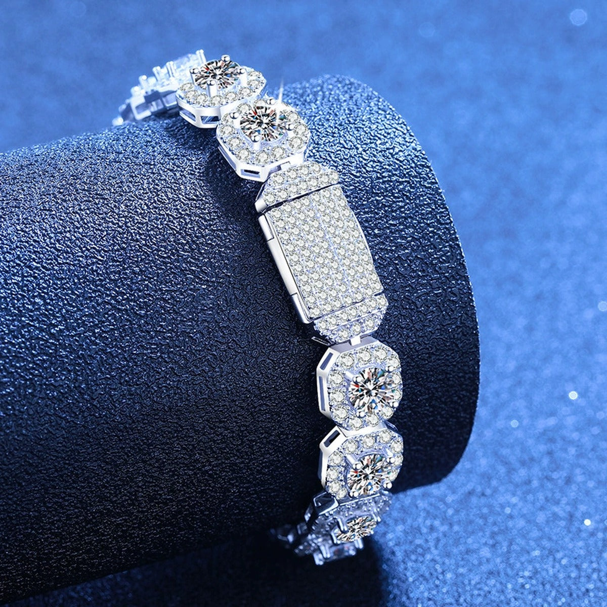Wide Moissanite Tennis Bracelet with CZ styled on blue display background showing moissanite sparkle and chain detail