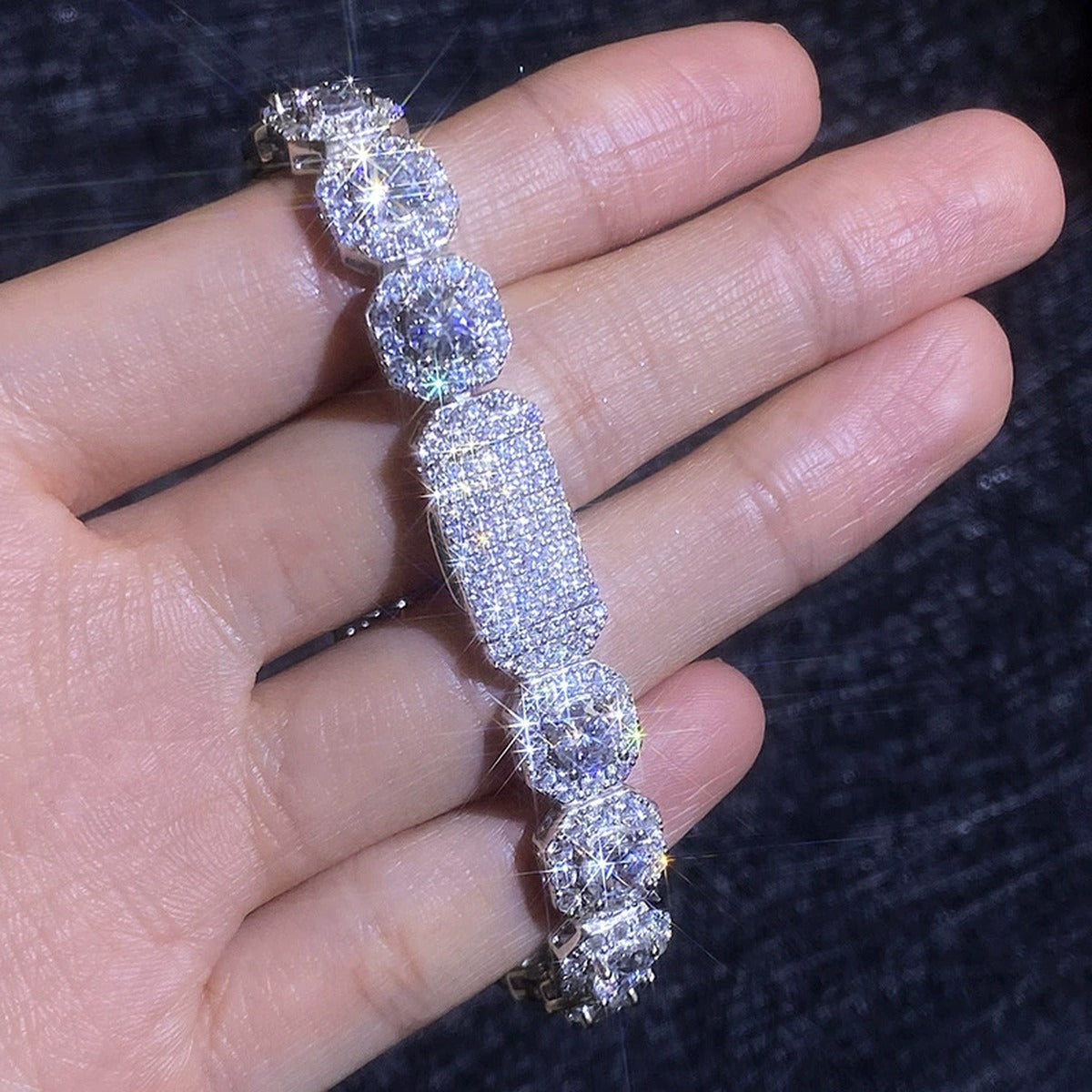 Wide Moissanite Tennis Bracelet with CZ hand-held close-up showing stone detail, width, and bracelet finish