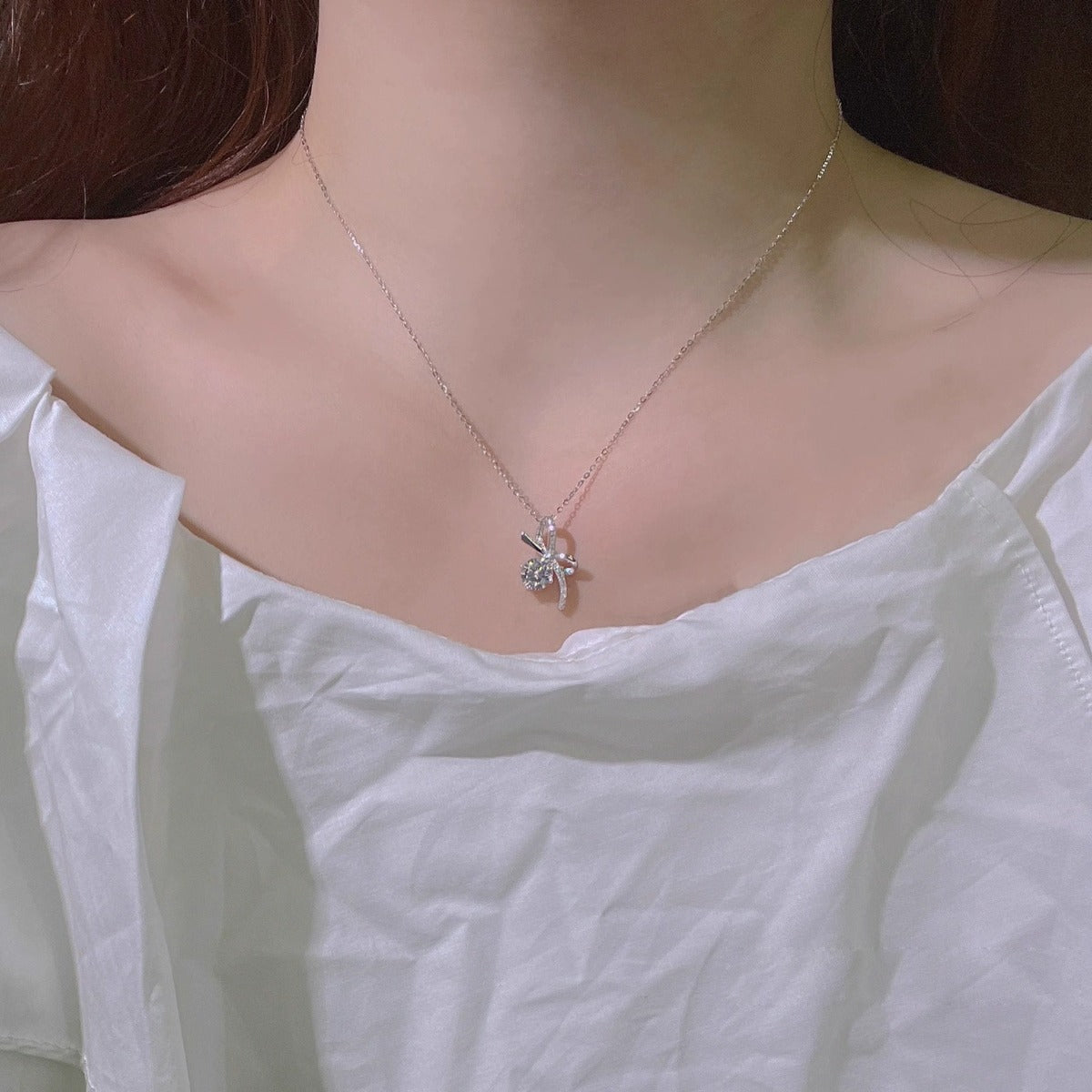 Bowknot Round Moissanite Necklace with CZ in White Gold-Plated S925 sterling silver neckline model view showing pendant scale and chain length