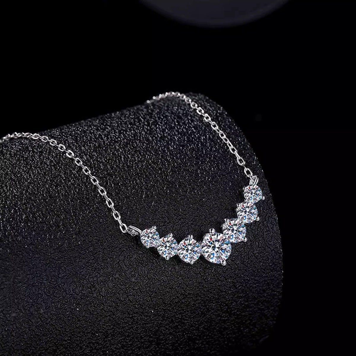 Seven-Stone Moissanite Necklace in Gold-Plated S925 sterling silver blue display scene showing chain and stone layout