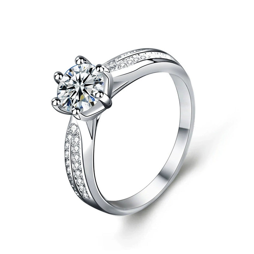 Six-Prong Round Moissanite Engagement Ring with CZ in white gold-plated S925 sterling silver on clean white background