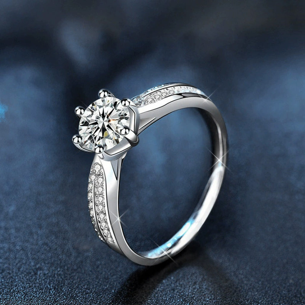 Six-Prong Round Moissanite Engagement Ring with CZ close-up detail view with moissanite sparkle