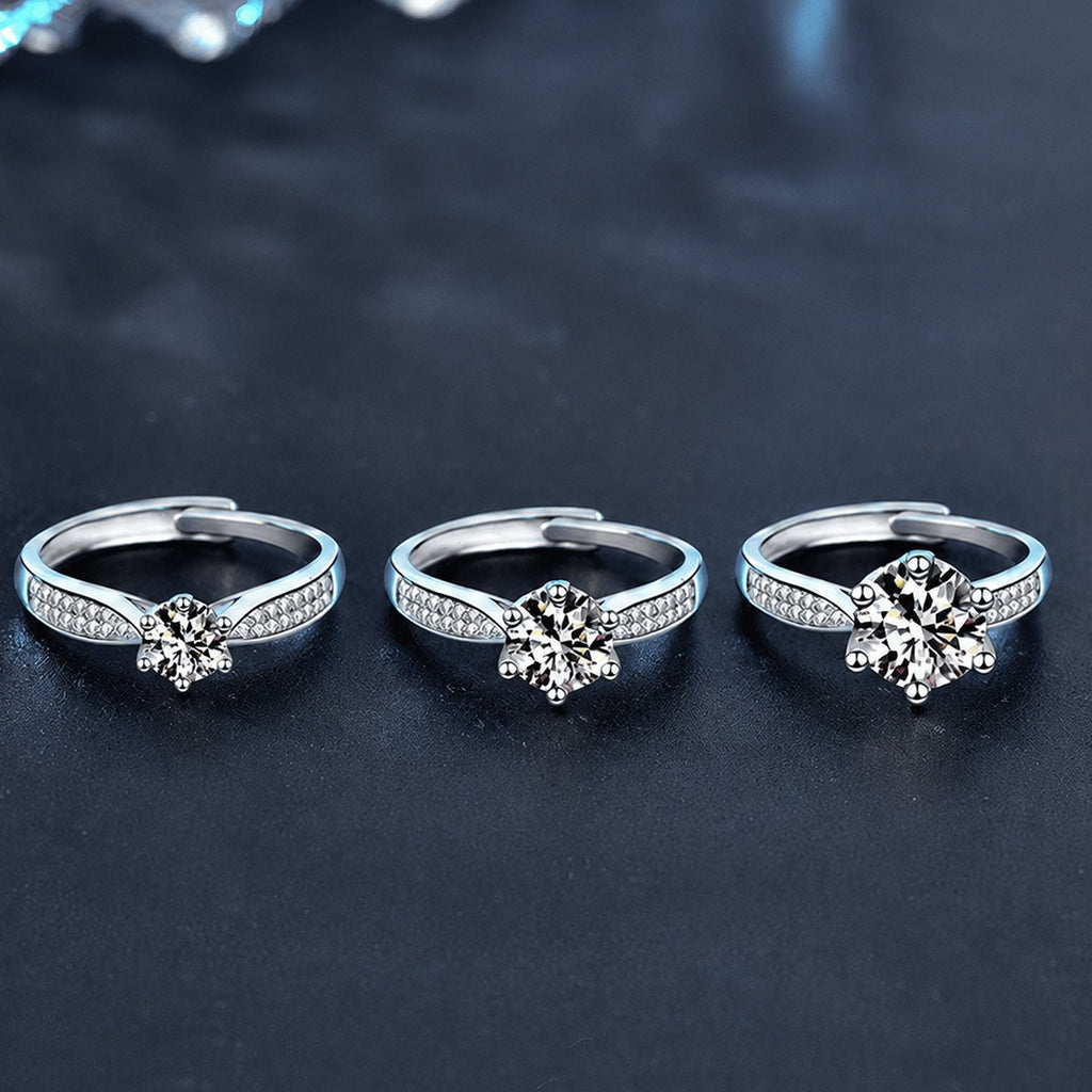 Starburst Six-Prong Round Moissanite Engagement Ring with CZ close-up detail view with moissanite sparkle