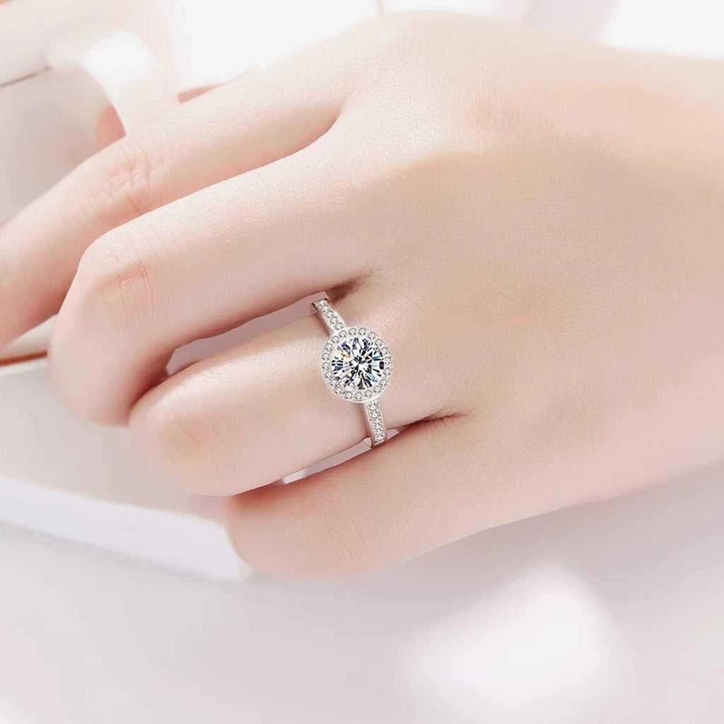 Round Halo Moissanite Engagement Ring with CZ worn on hand to show scale, band width, and ring profile