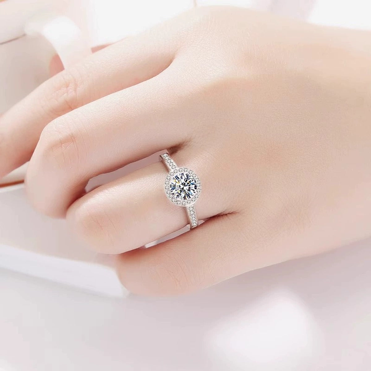 Round Halo Moissanite Engagement Ring with CZ worn on hand to show scale, band width, and ring profile
