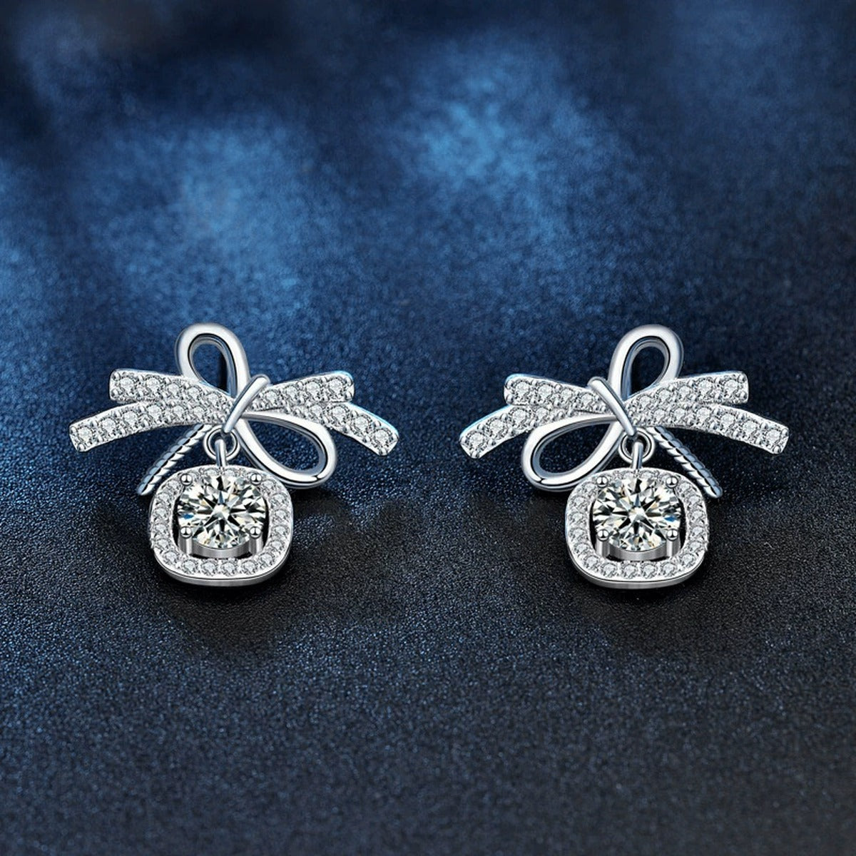 Bowknot Round Moissanite Stud Dangle Earrings with CZ in White Gold-Plated S925 sterling silver product scene view showing angled setting detail