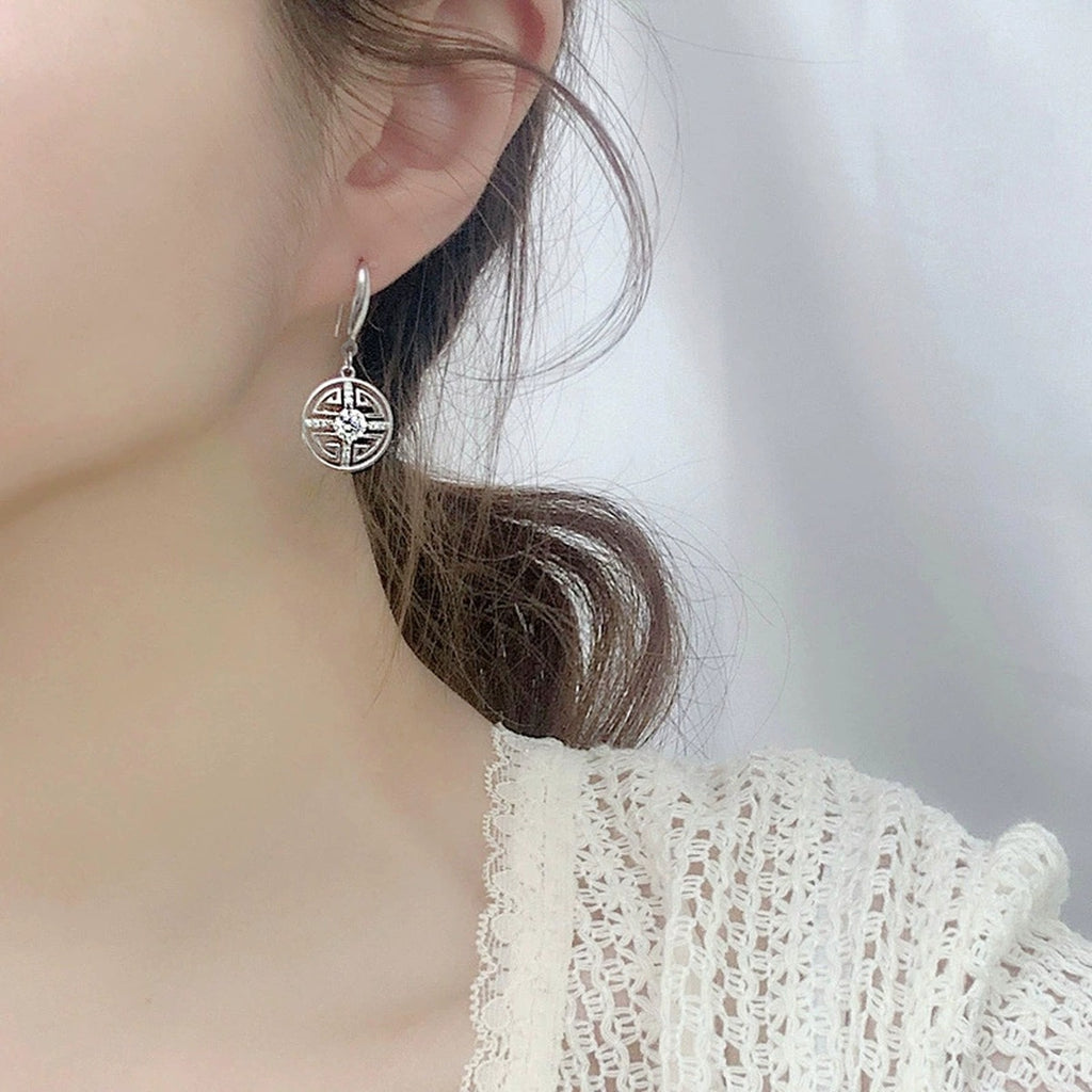 Longevity Motif Round Moissanite Hook Dangle Earrings with CZ in White Gold-Plated S925 sterling silver worn on ear by model showing scale, placement, and hook dangle earrings styling