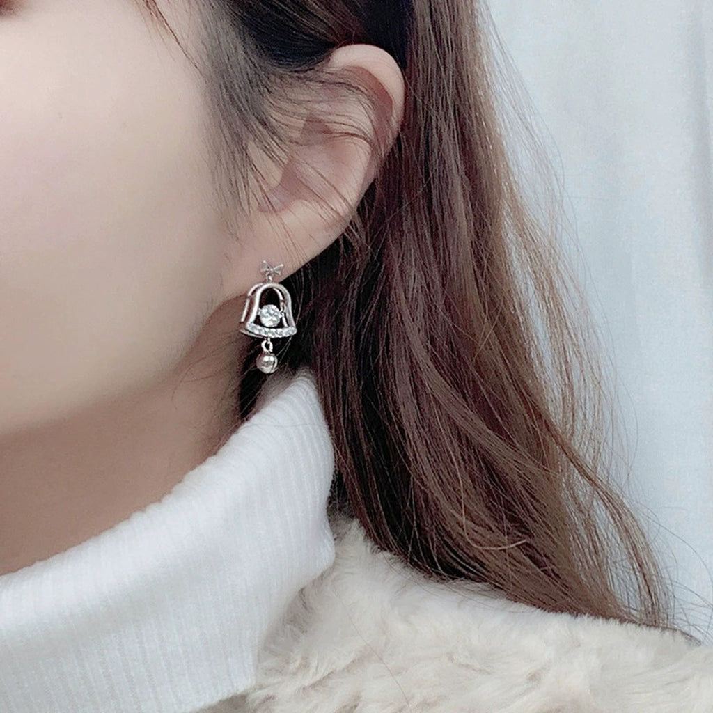 Christmas Bell Round Moissanite Stud Dangle Earrings with CZ in White Gold-Plated S925 sterling silver worn on ear by model showing scale, placement, and stud dangle earrings styling