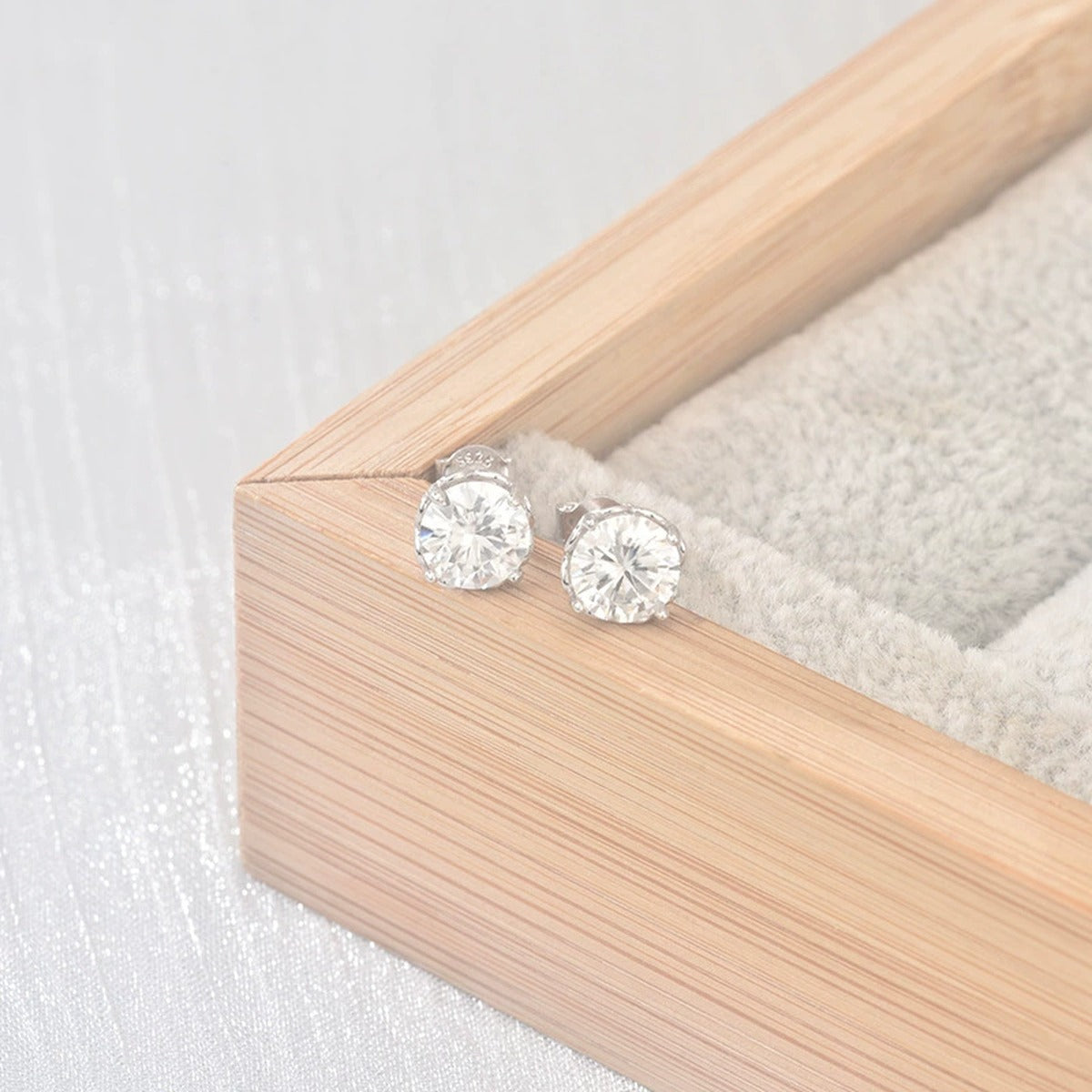 Four-Prong Round Moissanite Solitaire Stud Earrings in Gold-Plated S925 sterling silver product scene view showing pair comparison