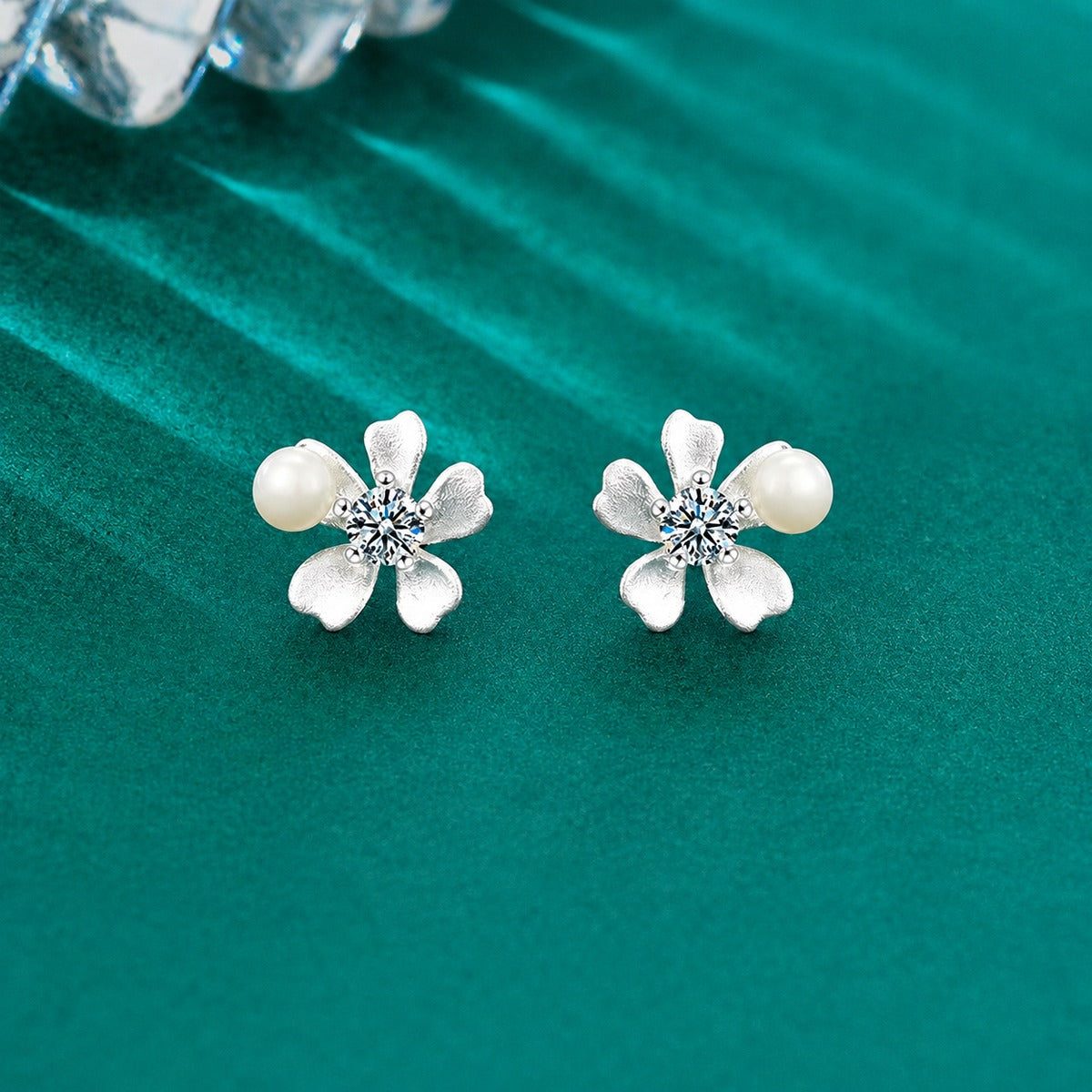 Orchid Pearl Round Moissanite Stud Earrings in Gold-Plated S925 sterling silver product scene view showing angled setting detail