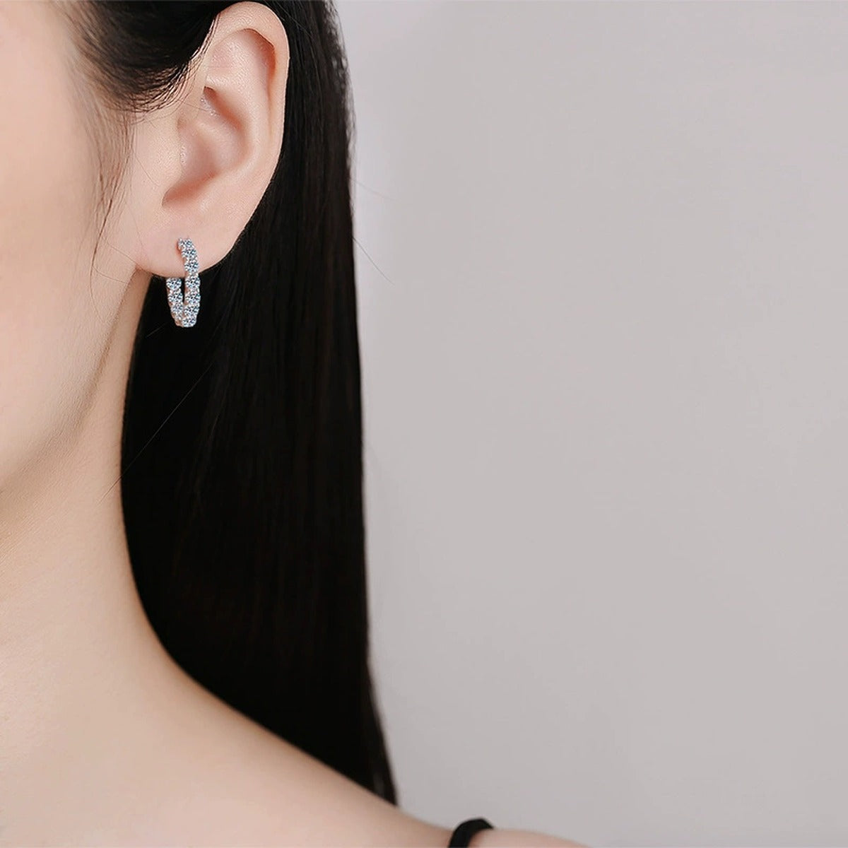Inside-Out Round Moissanite Hoop Earrings in White Gold-Plated S925 sterling silver worn on ear by model showing scale, placement, and hoop earrings styling