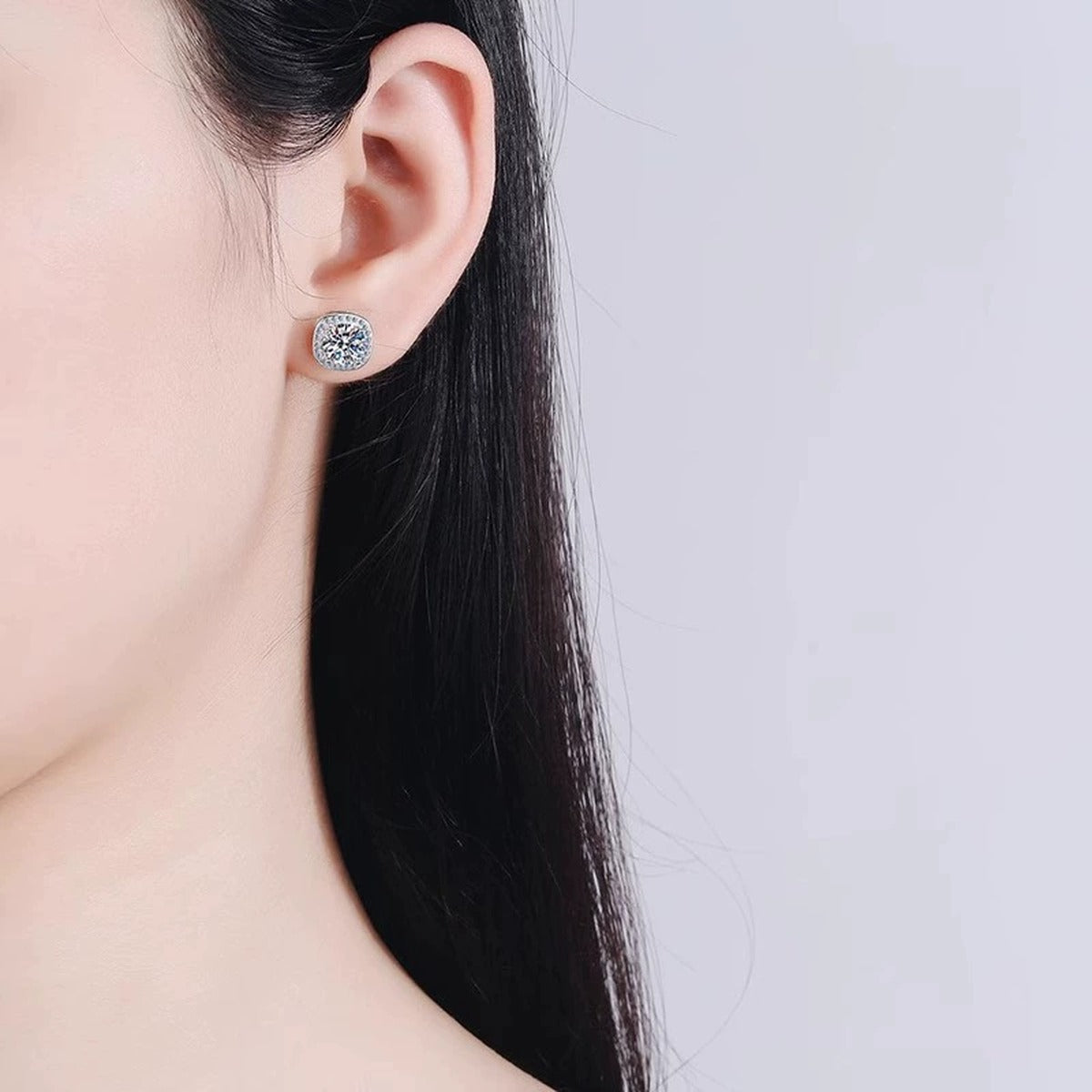 Cushion Halo Round Moissanite Stud Earrings with CZ in Gold-Plated S925 sterling silver worn on ear by model showing scale, placement, and stud earrings styling