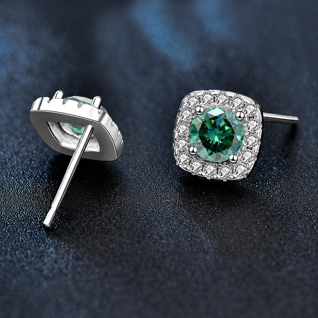 Green round moissanite cushion halo stud earrings shown from the front with vivid color and CZ framing