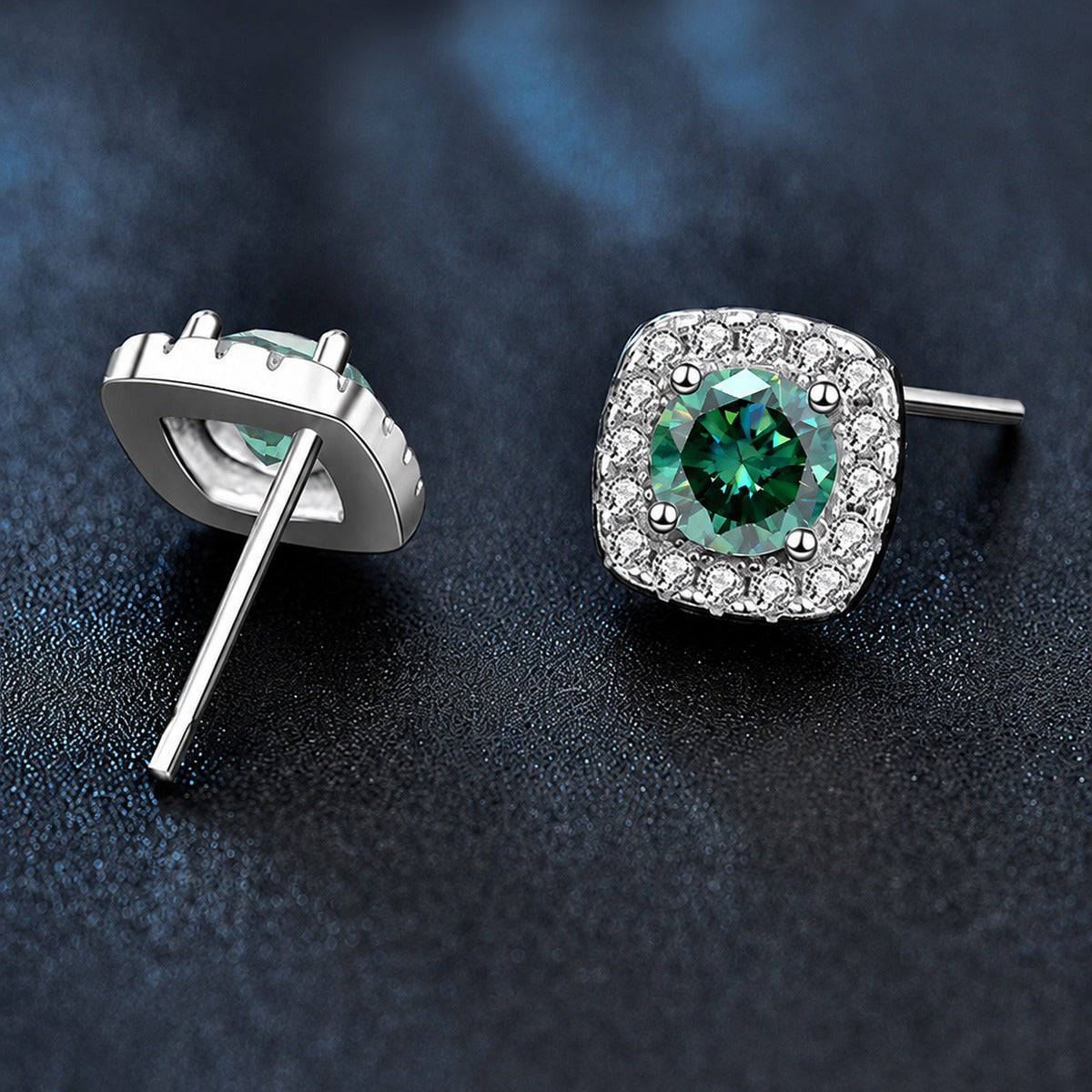 Green round moissanite cushion halo stud earrings shown from the front with vivid color and CZ framing