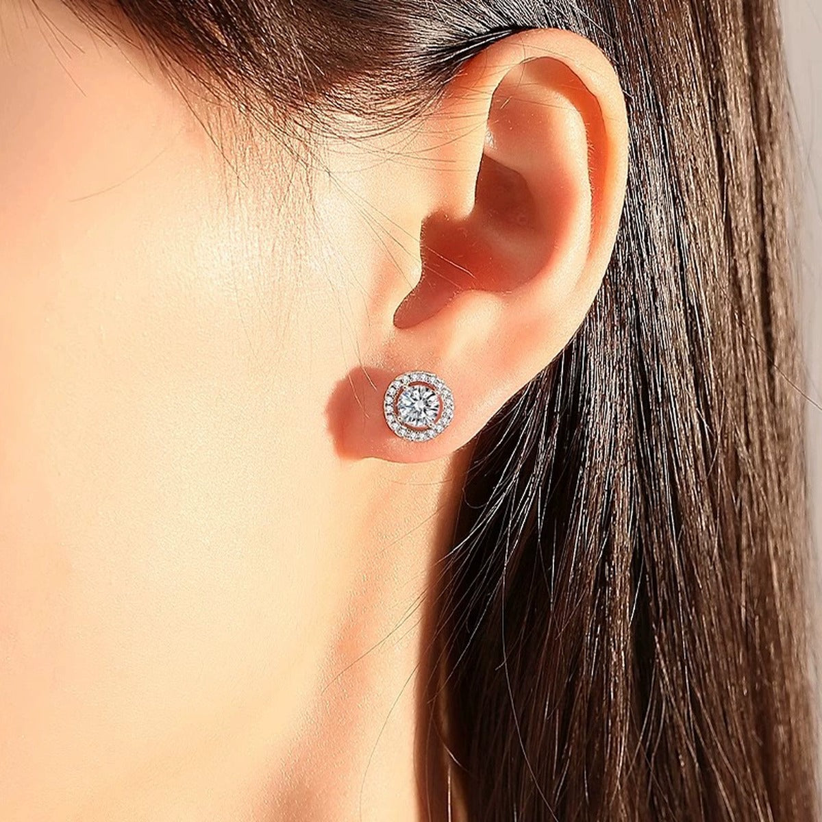 Round Halo Moissanite Stud Earrings with CZ in White Gold-Plated S925 sterling silver worn on ear by model showing scale, placement, and stud earrings styling