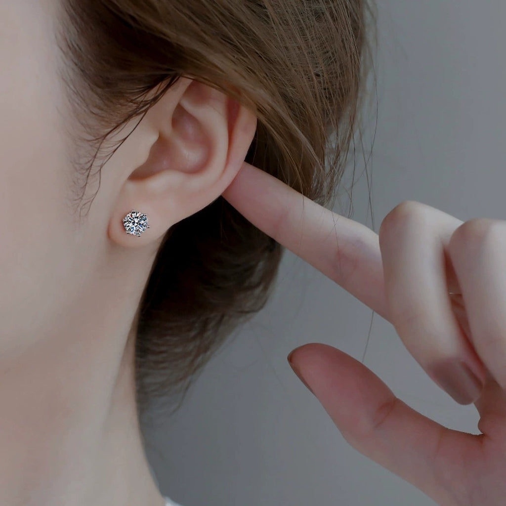 Six-Prong Colored Moissanite Stud Earrings in Gold-Plated S925 sterling silver worn on ear by model showing scale, placement, and stud earrings styling