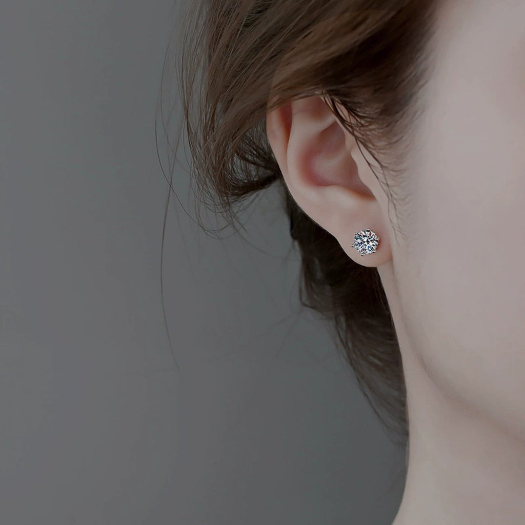 Six-Prong Colored Moissanite Stud Earrings in Gold-Plated S925 sterling silver worn on ear by model showing scale, placement, and stud earrings styling