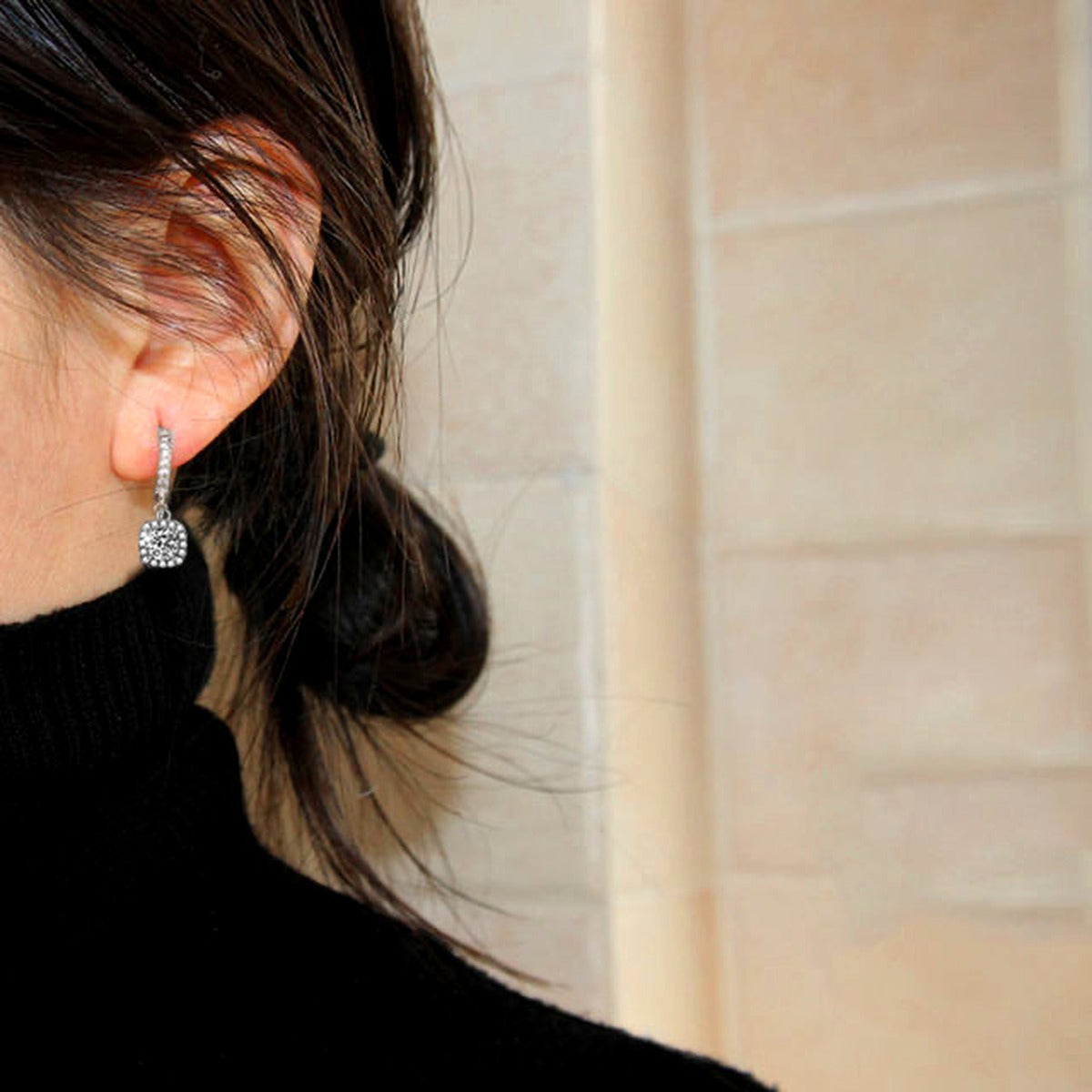 Cushion Halo Round Moissanite Hoop Dangle Earrings with CZ in White Gold-Plated S925 sterling silver worn on ear by model showing scale, placement, and hoop dangle earrings styling