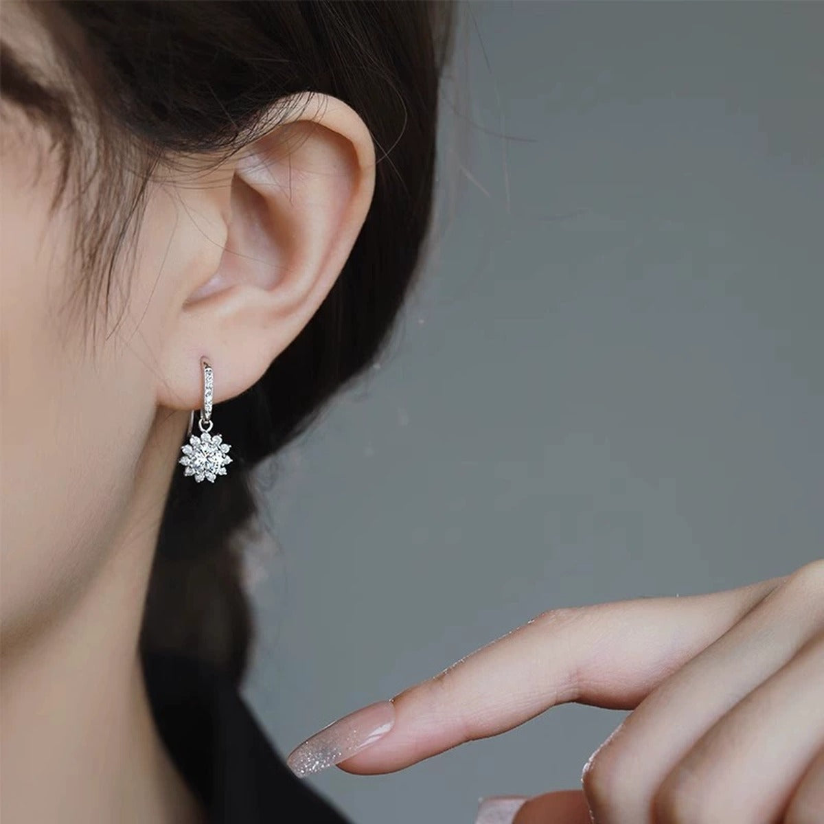 Floral Halo Round Moissanite Hook Dangle Earrings with CZ in White Gold-Plated S925 sterling silver worn on ear by model showing scale, placement, and hook dangle earrings styling
