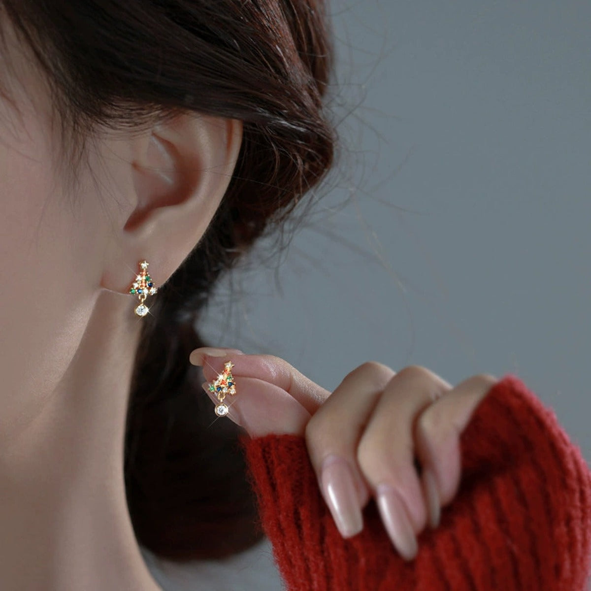 Christmas Tree Round Moissanite Stud Dangle Earrings with CZ in Gold-Plated S925 sterling silver worn on ear by model showing scale, placement, and stud dangle earrings styling