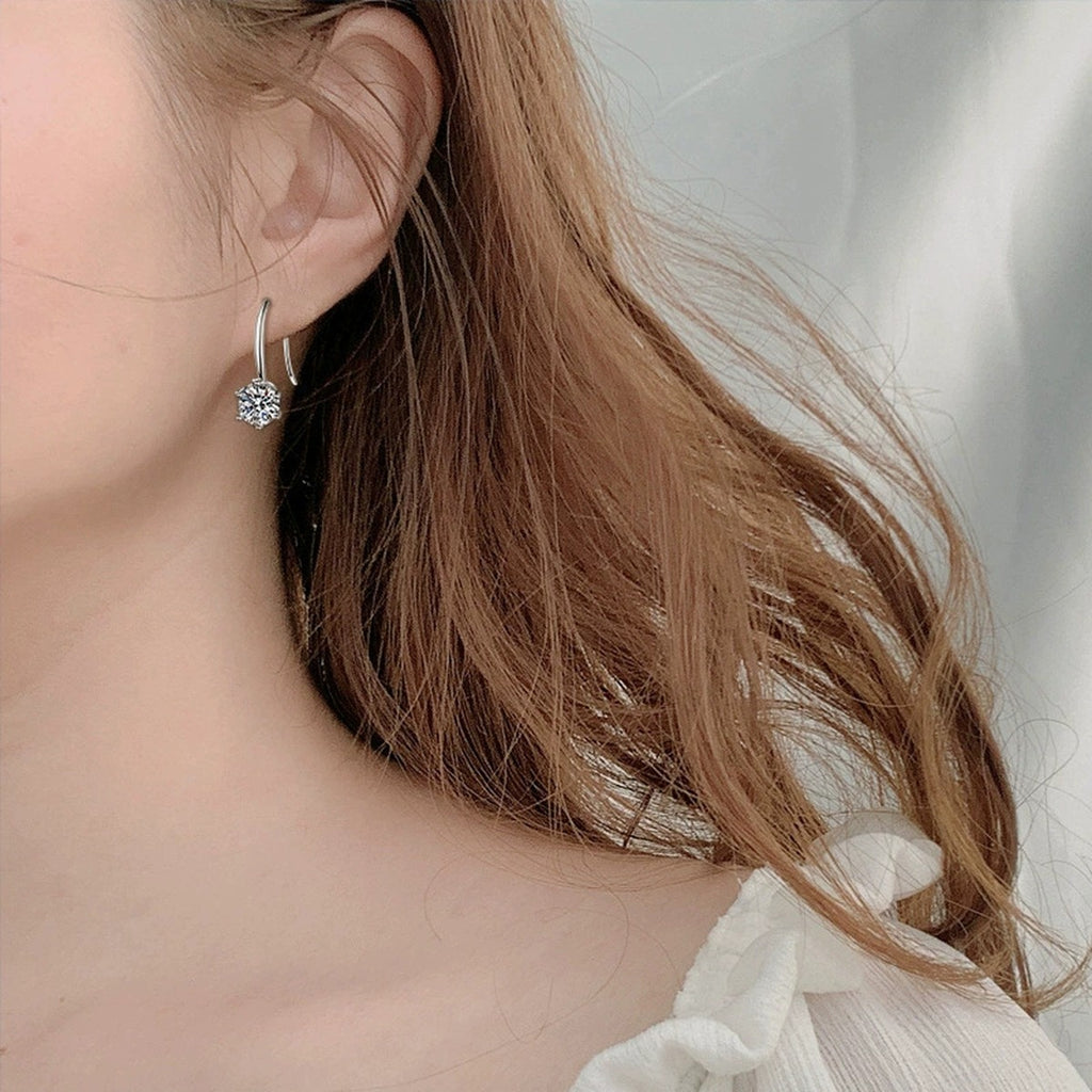 Round Moissanite Solitaire Hook Drop Earrings in White Gold-Plated S925 sterling silver worn on ear by model showing scale, placement, and hook drop earrings styling