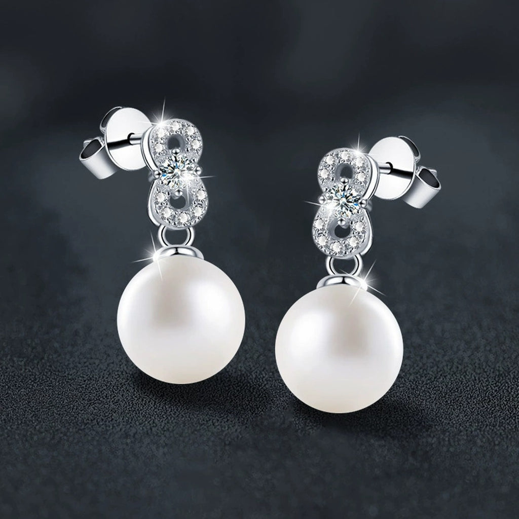 Infinity Round Moissanite and Pearl Stud Dangle Earrings with CZ in White Gold-Plated S925 sterling silver product scene view showing angled setting detail