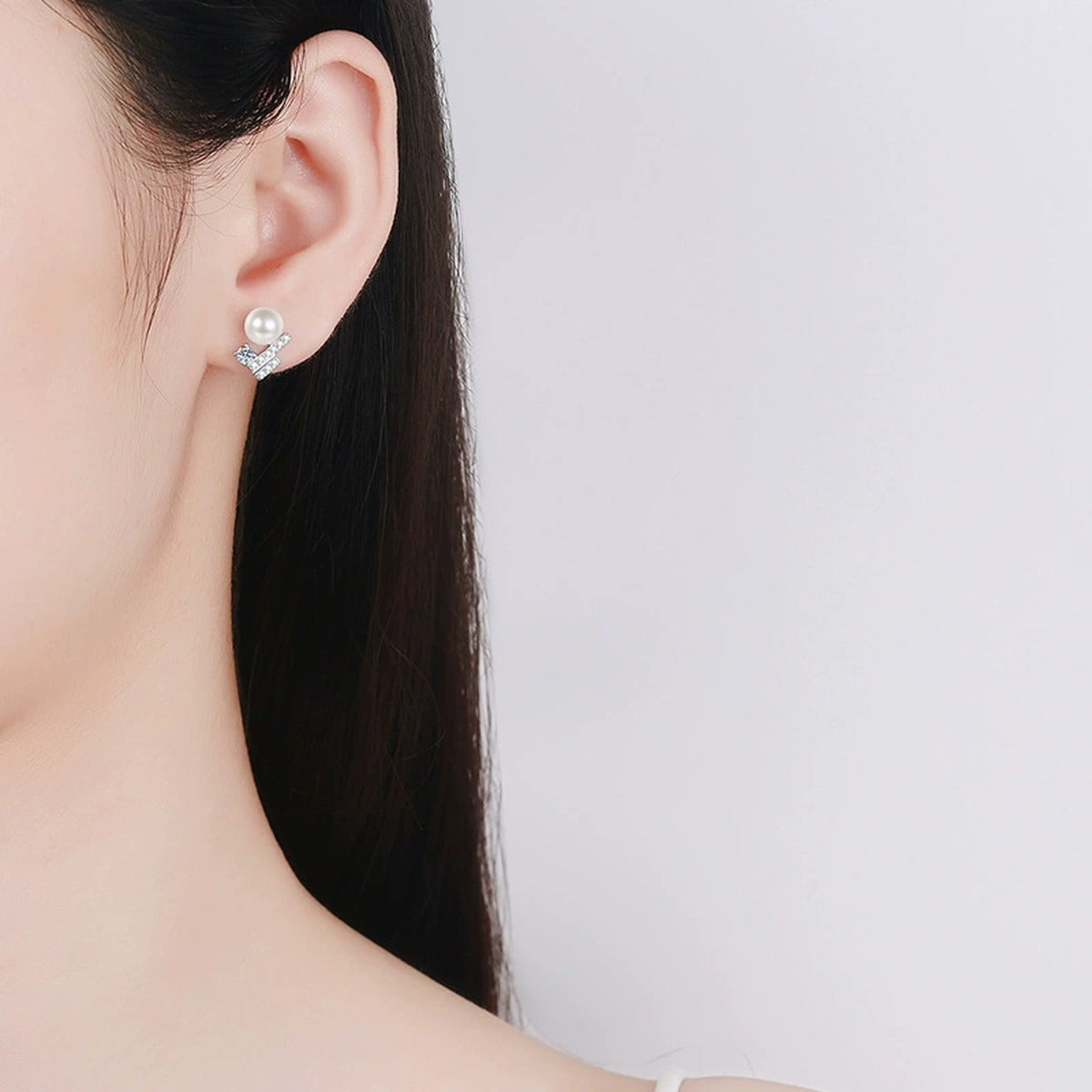 Geometric Moissanite and Pearl Stud Earrings with CZ in White Gold-Plated S925 sterling silver worn on ear by model showing scale, placement, and stud earrings styling