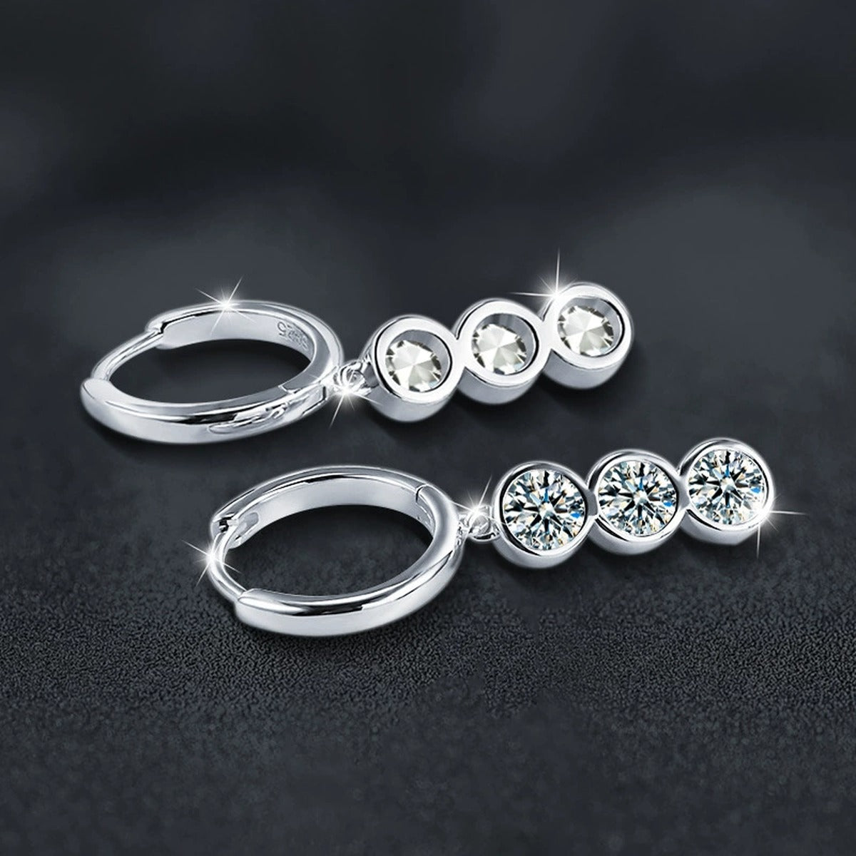 Graduated Round Moissanite Hoop Dangle Earrings in White Gold-Plated S925 sterling silver product scene view showing angled setting detail