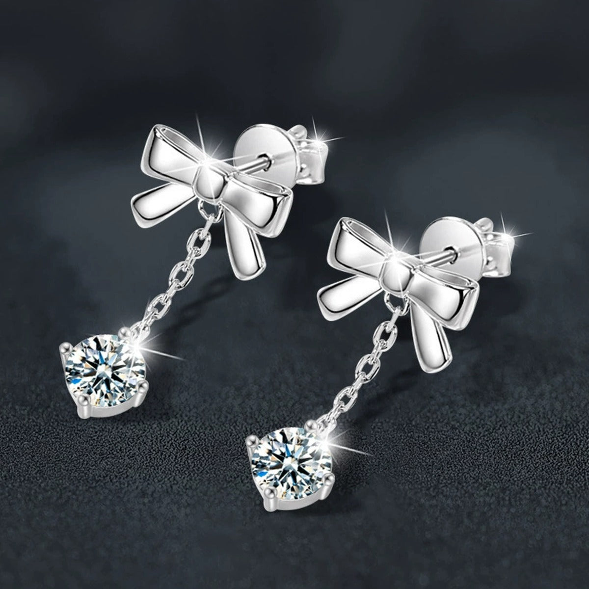 Bowknot Round Moissanite Stud Dangle Earrings in White Gold-Plated S925 sterling silver product scene view showing angled setting detail