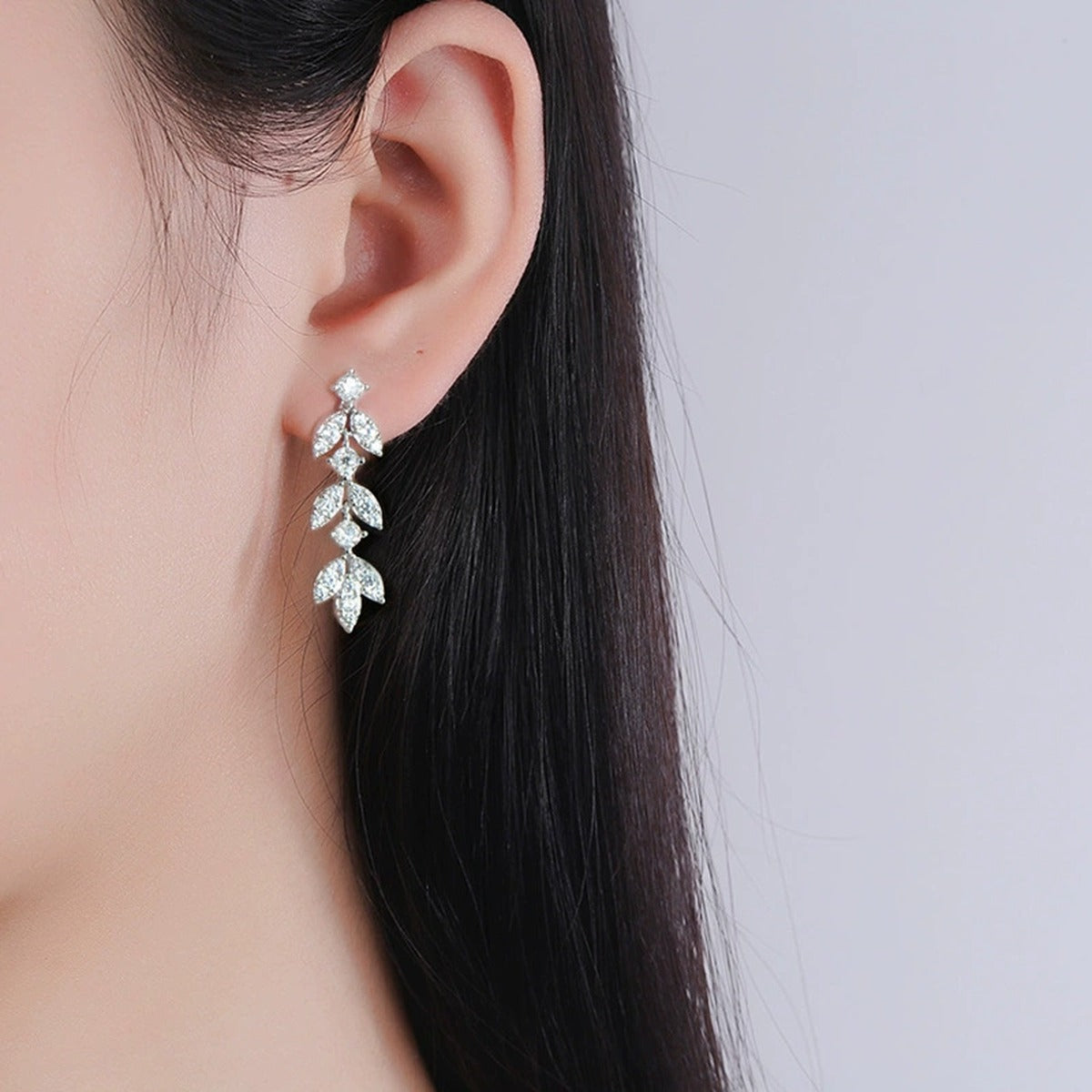 Leaf Tassel Round Moissanite Stud Dangle Earrings with CZ in White Gold-Plated S925 sterling silver worn on ear by model showing scale, placement, and stud dangle earrings styling