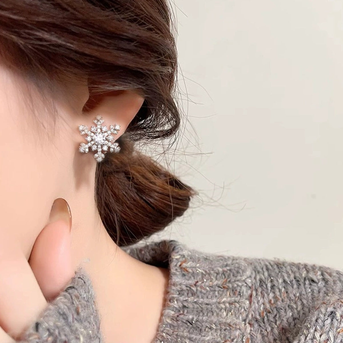 Snowflake Round Moissanite Stud Earrings with CZ in White Gold-Plated S925 sterling silver worn on ear by model showing scale, placement, and stud earrings styling