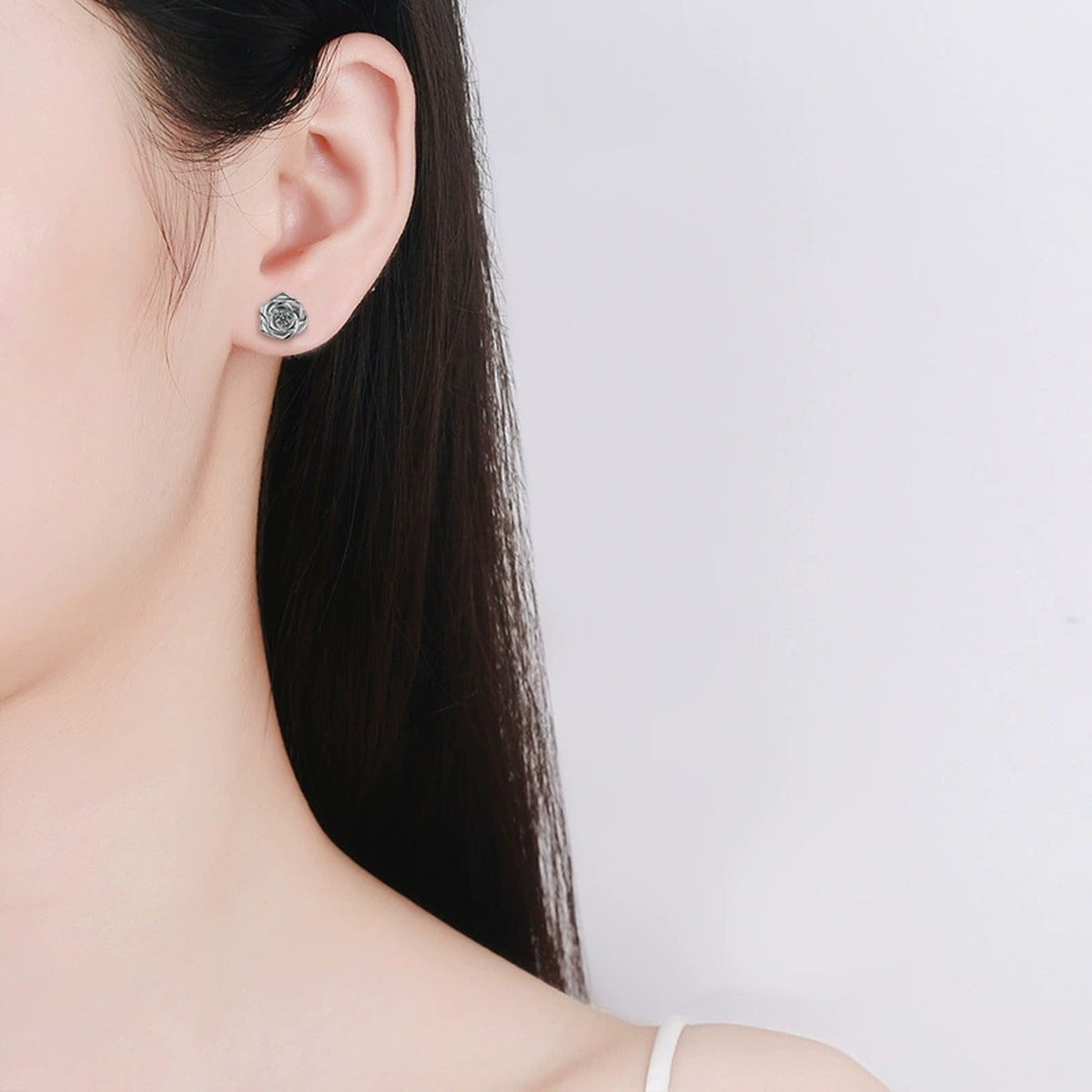 Rose Flower Round Moissanite Stud Earrings in Gold-Plated S925 sterling silver worn on ear by model showing scale, placement, and stud earrings styling