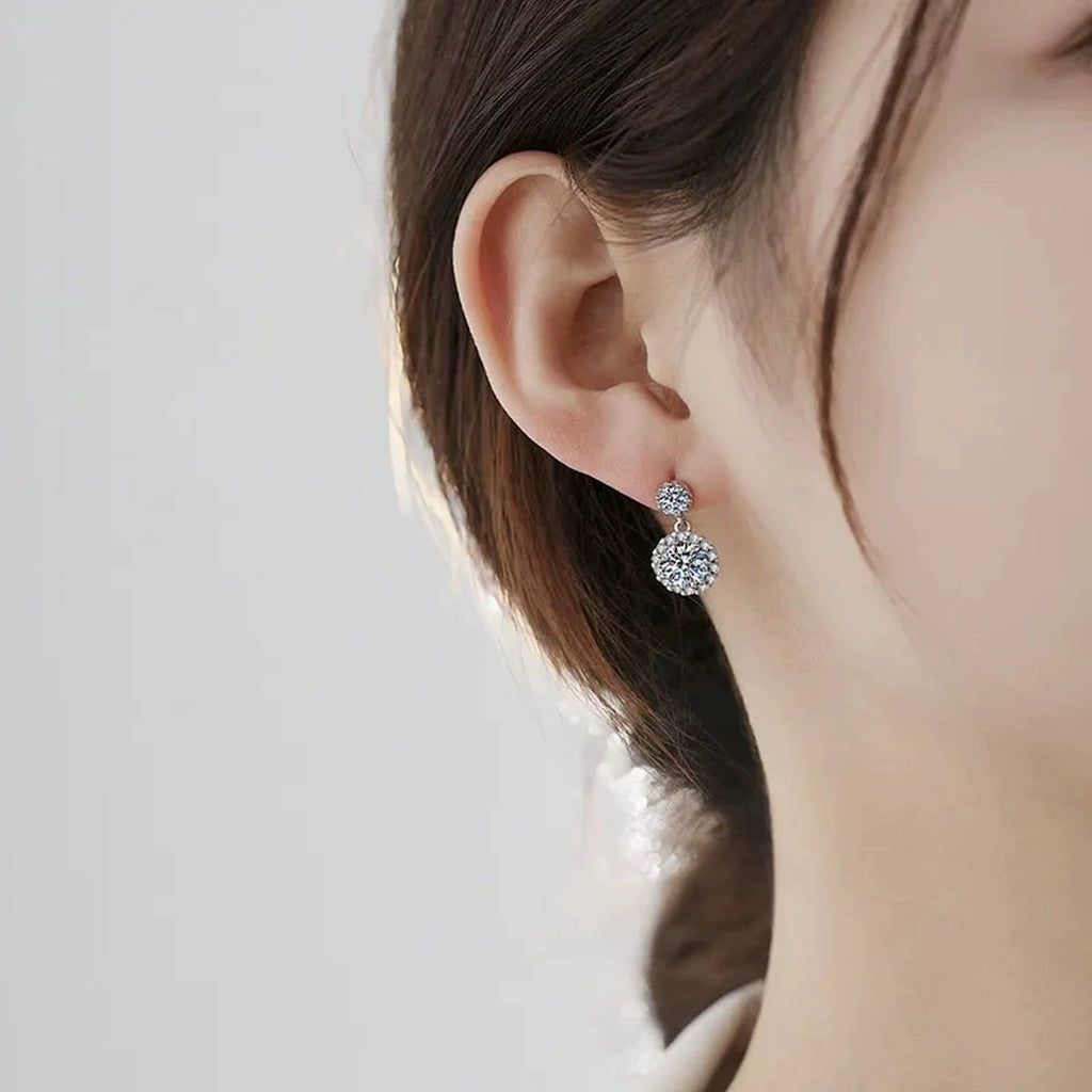 Double Halo Round Moissanite Stud Dangle Earrings with CZ in White Gold-Plated S925 sterling silver worn on ear by model showing scale, placement, and stud dangle earrings styling