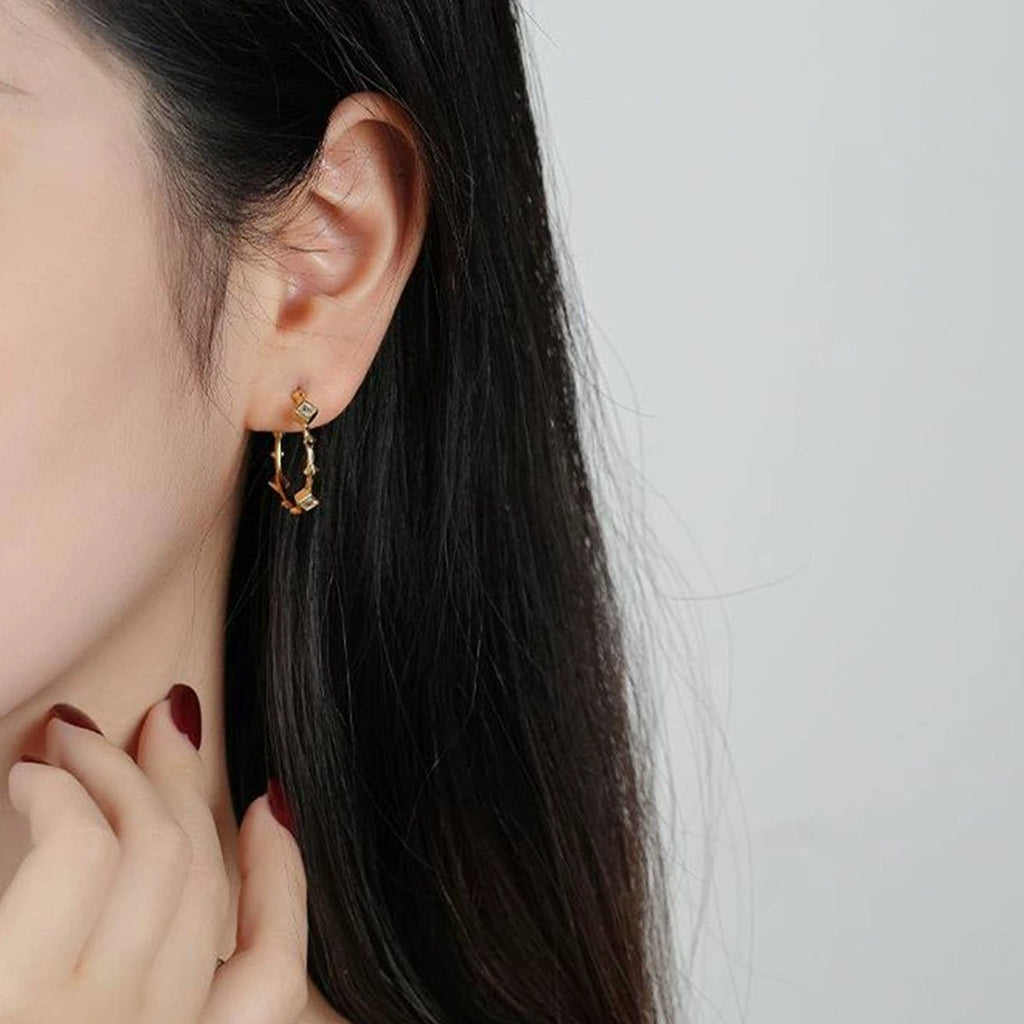 Princess-Cut Moissanite Geometric Stud Hoop Earrings in Gold-Plated S925 sterling silver worn on ear by model showing scale, placement, and stud earrings styling