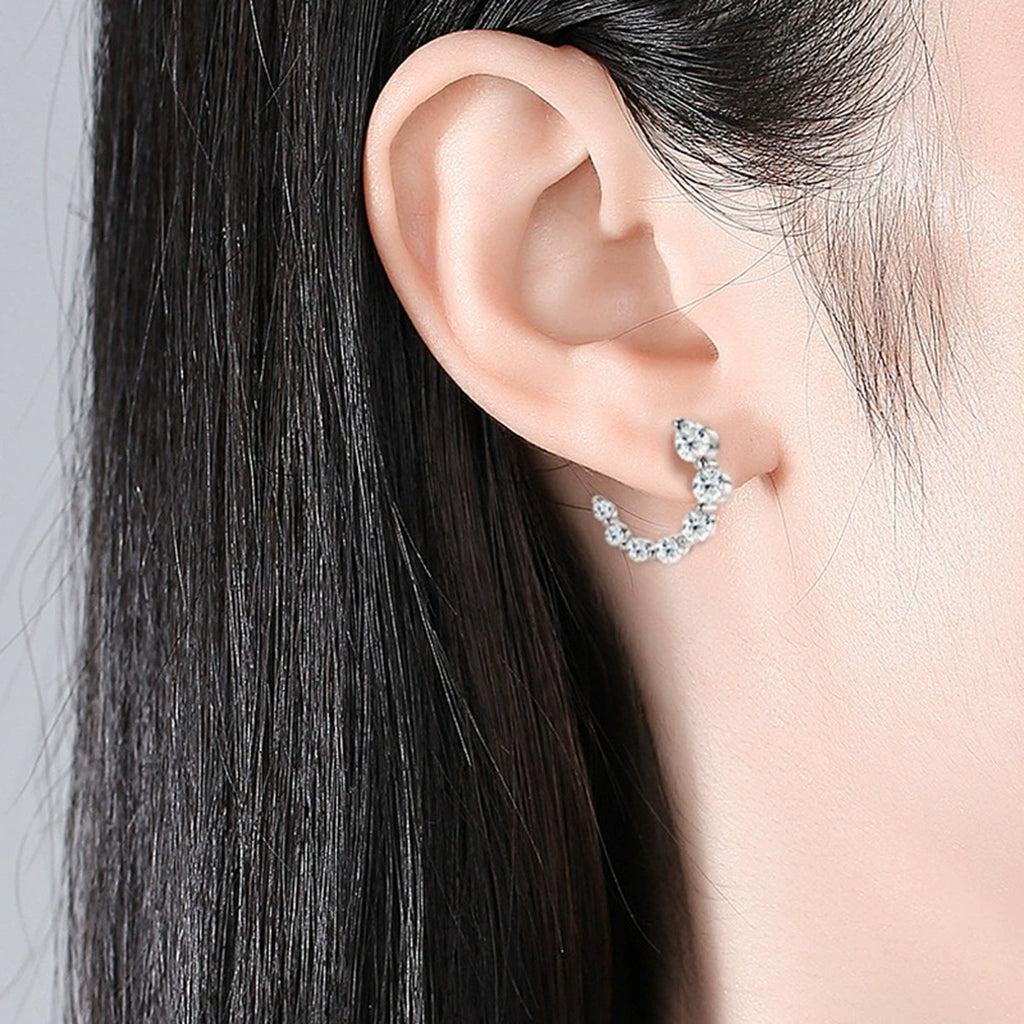 Crescent Moon Graduated Moissanite Stud Drop Earrings in Gold-Plated S925 sterling silver worn on ear by model showing scale, placement, and stud earrings styling