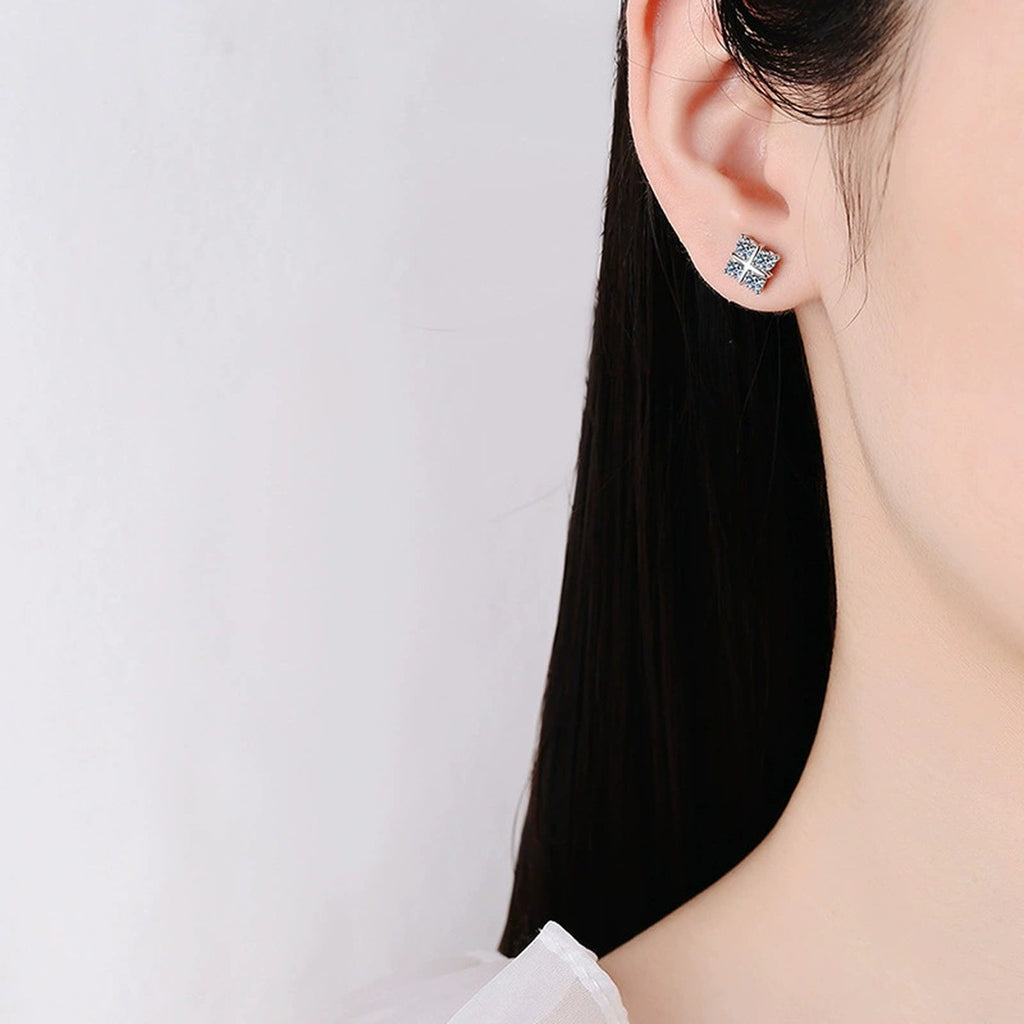 Four-Leaf Clover Round Moissanite Stud Earrings in Gold-Plated S925 sterling silver worn on ear by model showing scale, placement, and stud earrings styling