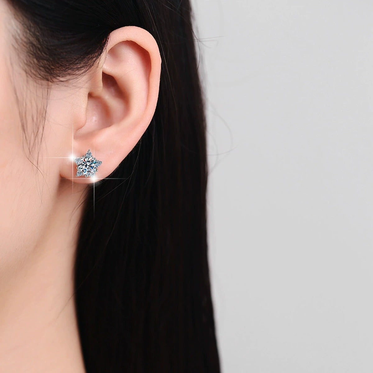 Five-Point Star Round Moissanite Stud Earrings with CZ in Gold-Plated S925 sterling silver worn on ear by model showing scale, placement, and stud earrings styling