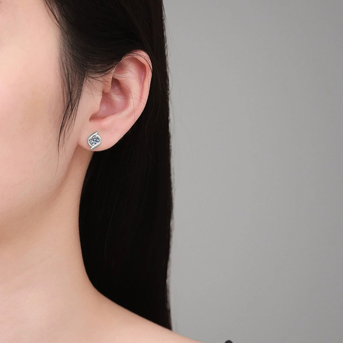 Pinwheel Round Moissanite Stud Earrings in Gold-Plated S925 sterling silver worn on ear by model showing scale, placement, and stud earrings styling