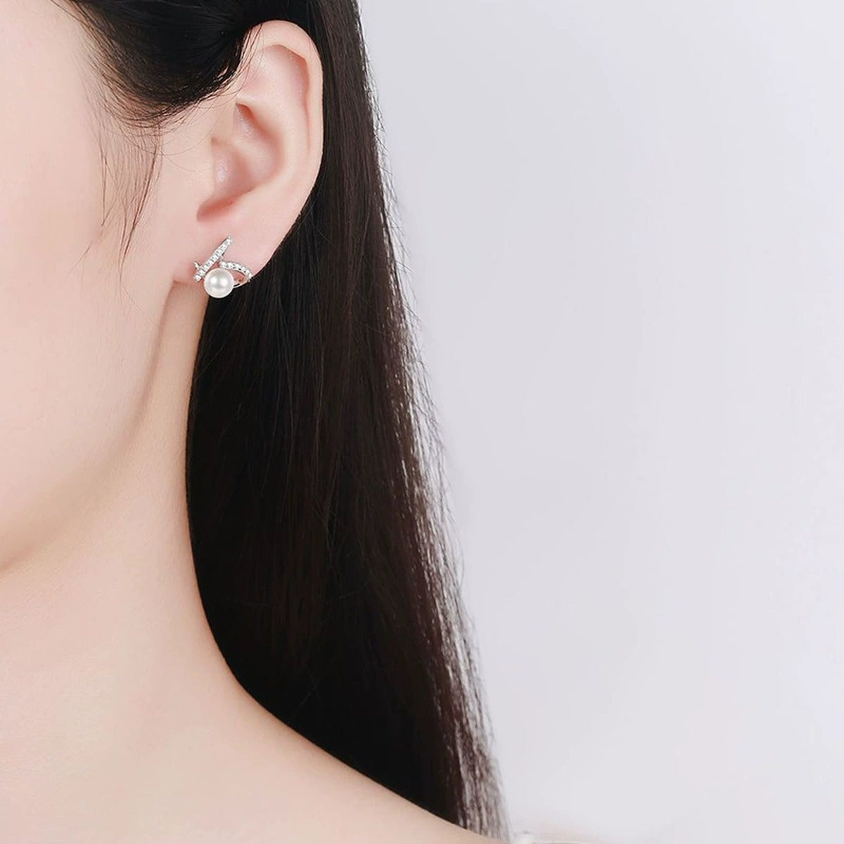 Heart Pearl Moissanite Stud Earrings in White Gold-Plated S925 sterling silver worn on ear by model showing scale, placement, and stud earrings styling